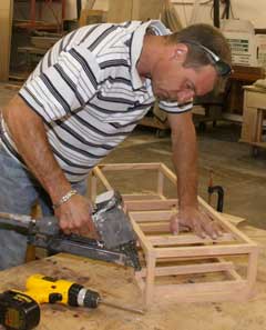 Image of Kermit building a wine rack